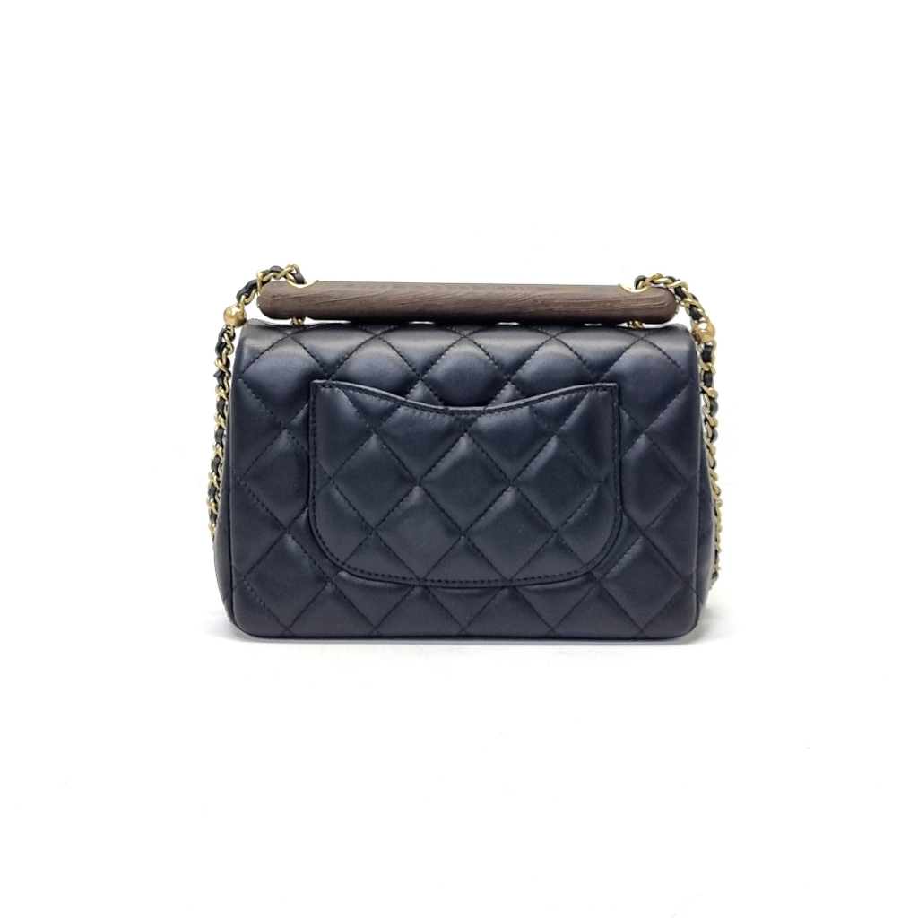 Small flap bag with top handle, Lambskin & wenge wood, black — Fashion